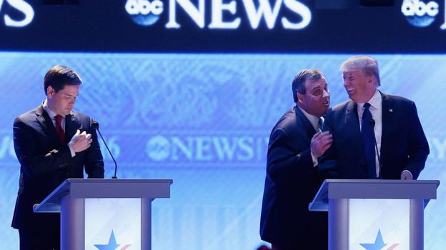 Chris Christie and Donald Trump joke at a primary debate in New Hampshire.