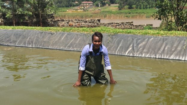 Sophie Ikenye wearing waders in the water