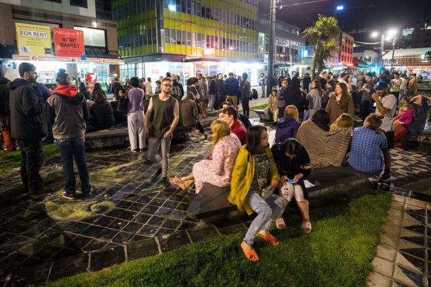 People wait in Te Aro Park after being evacuated from nearby buildings following an earthquake on 14 November 2016 in Wellington, New Zealand