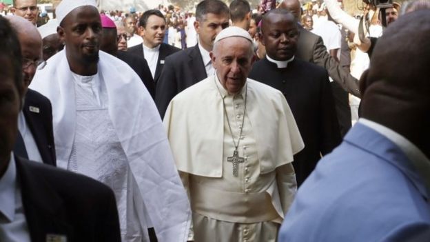 Pope Francis is welcomed by Imam Tiding Moussa Naibi, left, on the occasion of his visit at the Central Mosque in Bangui