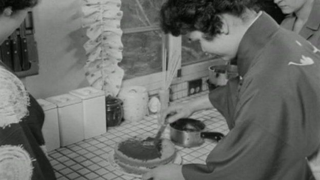 Japanese woman learning how to bake a cake