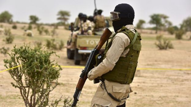 Niger Army armed forces patrol during a visit of Niger's Interior Minister to a refugee camp near Diffa on June 16, 2016 following attacks by Boko Haram fighters in the region.
