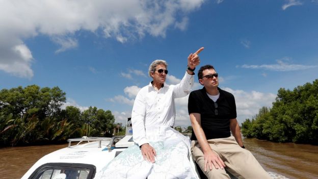 John Kerry, left, with historian Edward Miller, travelling along the Mekong Delta in Vietnam