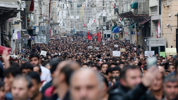 Protestors shout slogans against violence as they gather in reaction to the twin blasts in Ankara, for a rally in Istanbul, Turkey, 1