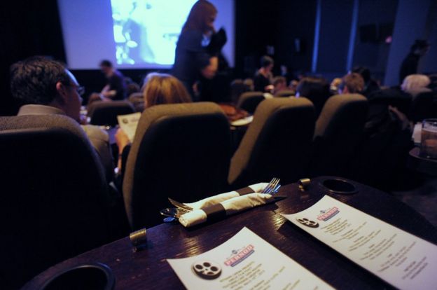 A place setting and menus are seen at a table in the Nitehawk Cinema in 2013 in the Williamsburgh neighborhood of Brooklyn in New York.