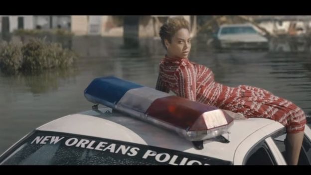 Beyonce on a submerged police car