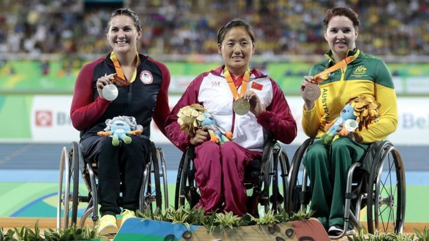 Silver medalist Chelsea McClammer of United States, gold medalist Hongzhuan Zhou of China and bronze medalist Angela Ballard celebrate on the podium