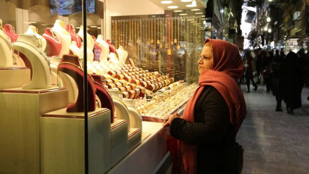 An Iranian woman looks at Jewellery in Tehran's ancient Grand Bazaar on January 16, 2016