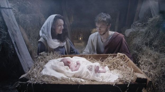 Couple in stable with baby