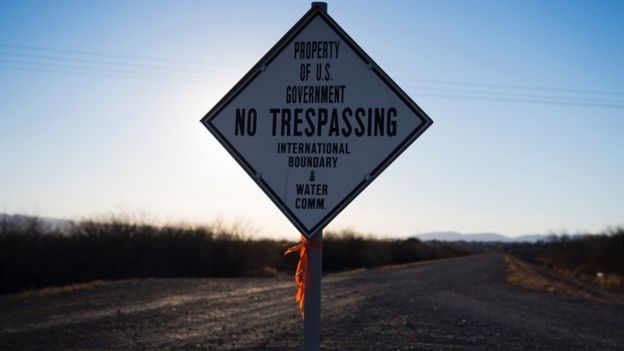 A sign warns against trespassing near the US/Mexico border in Presidio, Texas