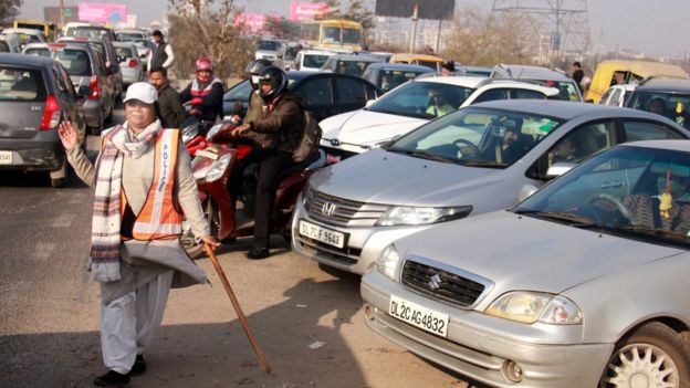 Ms Francis manages traffic at the intersection during peak morning and evening hours