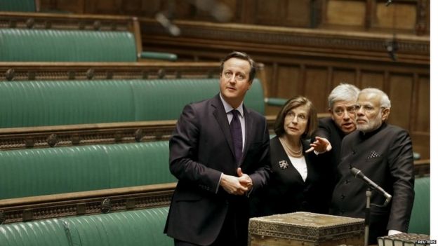 Narendra Modi being shown the chamber of the House of Commons by David Cameron, Commons Speaker John Bercow and Lords Speaker Baroness D'Souza