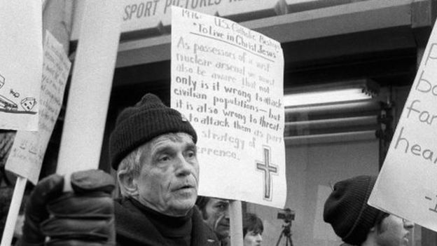 Daniel Berrigan marching with about 40 others outside of the Riverside Research Center in New York (09 April 1982)