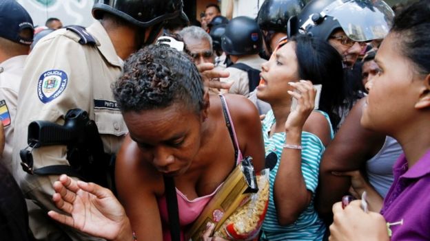 Trouble outside supermarket in Caracas