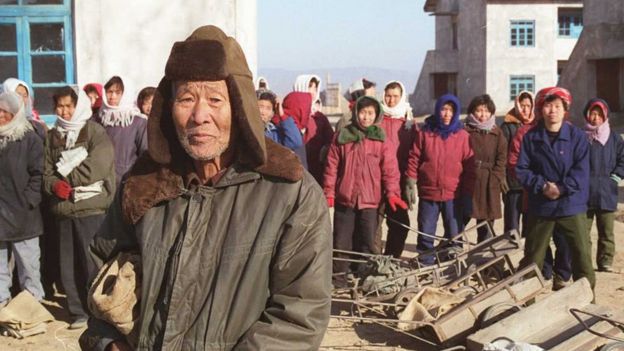 Residents of Taziri wait for Red Cross food supplies in December 1995 in North Korea