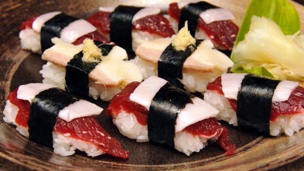 Whale sushi made from sliced minke meats, blubber and rice balls, at a sushi shop in Japanese whaling town Ayukawahama, Miyagi prefecture, on 16 June 2010