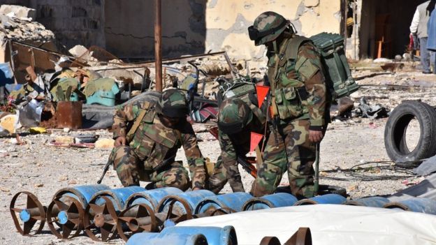 Government troops inspect home-made rebel rockets in recaptured eastern Aleppo - 6 December