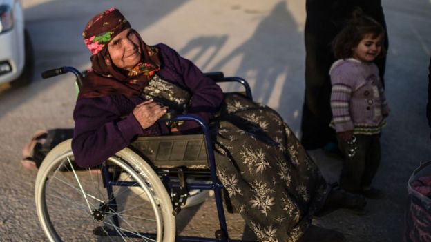 A Syrian refugee in a wheelchair at the Turkish border