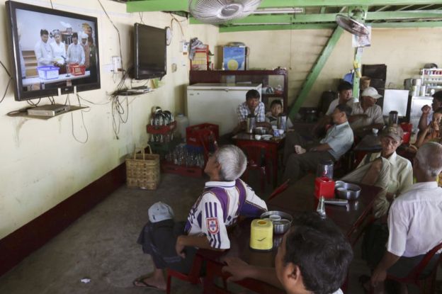 People watch the live broadcast of Myanmar