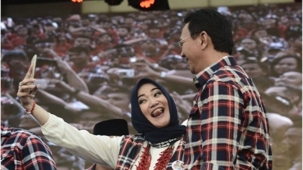 A supporter takes a selfie with Mr Purnama at his final campaign rally in Jakarta on 11 February 2017.