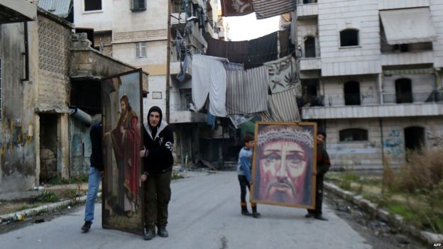 Christians carrying religious paintings in Aleppo