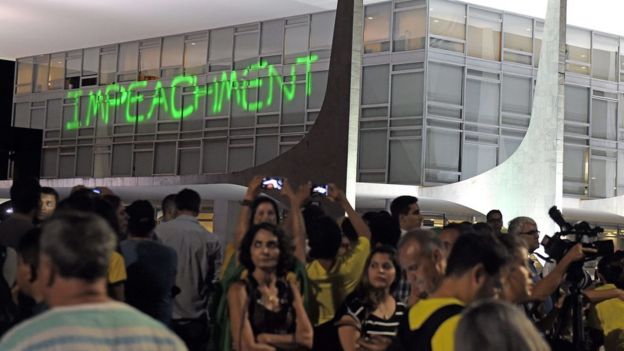 The word impeachment written with laser on the windows of the Planalto Palace, the seat of government in Brasilia, during a demonstration against the administration of President Dilma Rousseff on March 21, 2016.