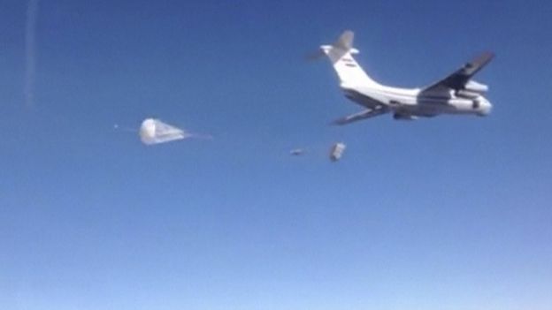 A Russian air force cargo plane drops off humanitarian aid in the region around the eastern Syrian city of Deir al-Zour, which is besieged by Islamic State militants, according to Russia's Defence Ministry, in this still image taken from video footage released by the ministry on January 15, 2016