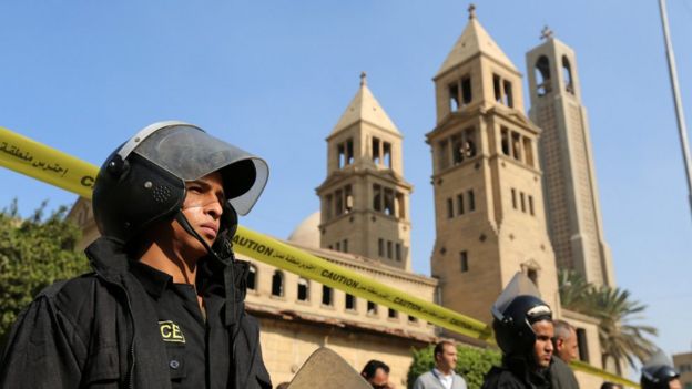 Members of the special police forces stand guard to secure the area around St. Mark's Coptic Orthodox Cathedral after an explosion inside the cathedral in Cairo