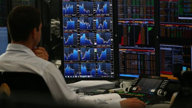 Trader in London looks at screens