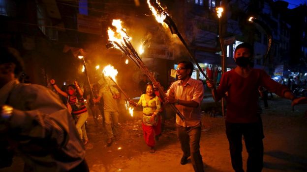 Tharu activists take part in a torch rally protesting against the proposed six provincial demarcations to be included on the new constitution, in Kathmandu, Nepal August 11, 2015