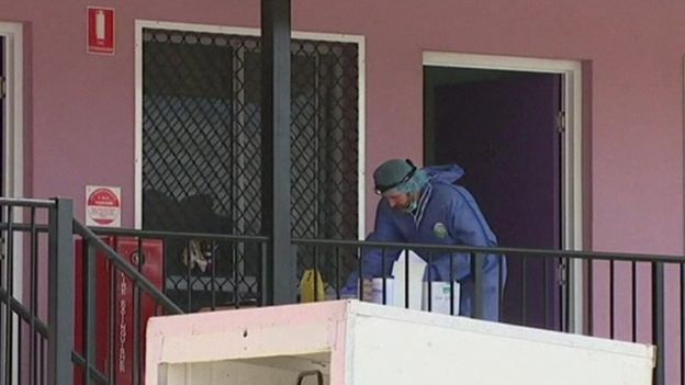 Forensic officer outside the hostel