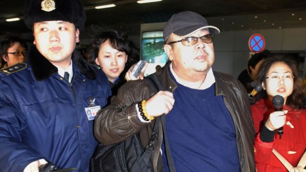 Kim Jong-nam wearing a leather jacket and baseball cap