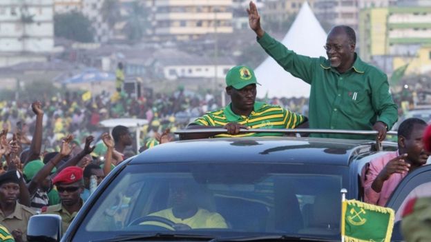 Presidential candidate John Magufuli waves to supporters after addressing a rally by ruling party Chama Cha Mapinduzi (CCM) in Dar es Salaam, Tanzania on October 23, 2015