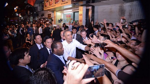 President Obama shakes hands with locals as he leaves the restaurant