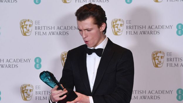 Tom seems to be quite happy at the BAFTAs!