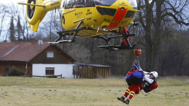 German rescue helicopter with an injured person underneath near the site. 9 Feb 2016