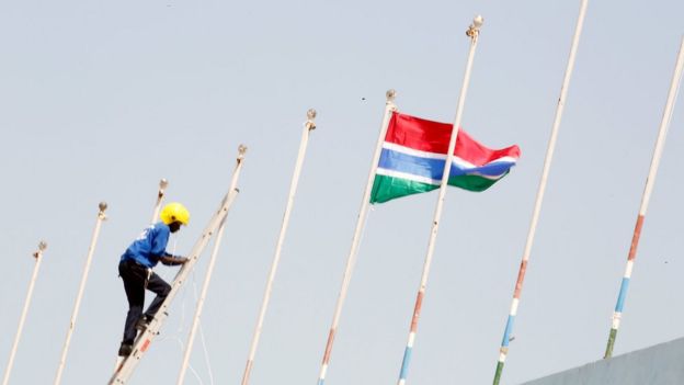 The Gambia's flag is hoisted above Independence Stadium for President Barrow's inauguration ceremony