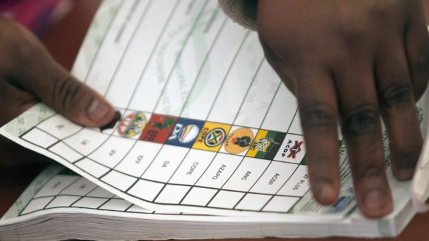 Election Commission worker tears ballot paper at voting station in Meyerton, Midvaal Municipality, south of Johannesburg, South Africa, 3 August 2016