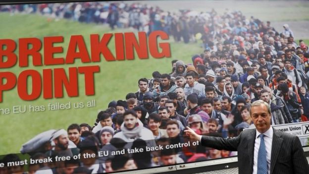 Nigel Farage standing in front of poster during EU referendum