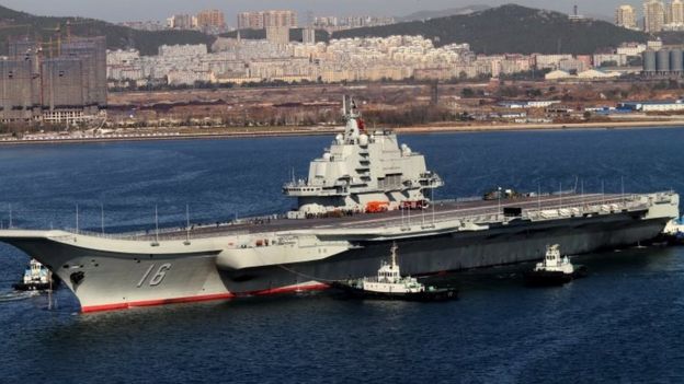The Liaoning, China's first aircraft carrier, returns to port after its first navy sea trial in Dalian in north-eastern China's Liaoning province (30 October 2012)