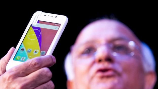 A Freedom 251 smartphone, which is to be priced at Indian Rupees 251 or USD 3.6 approximately, is shown during its release by an official of Ringing Bells Pvt. Ltd. in New Delhi, India, Wednesday, Feb. 17, 2016.