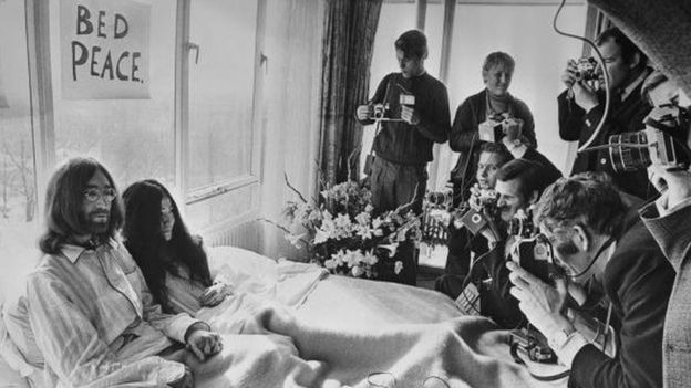 25th March 1969: Beatles singer, songwriter and guitarist John Lennon and his wife of a week Yoko Ono receive the press at their bedside in the Presidential Suite of the Hilton Hotel, Amsterdam. The couple stayed in bed for seven days 