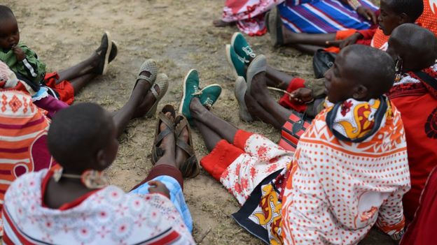 Kenyan Maasai women gather during a meeting dedicated to the practice of female genital mutilation (FGM) in which several participants voiced opposition to a ban currently in place, on June 12, 2014, in Enkorika, Kajiado, 75km from Nairobi