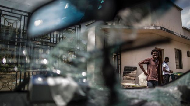 a damaged car inside Mr Ping's HQ