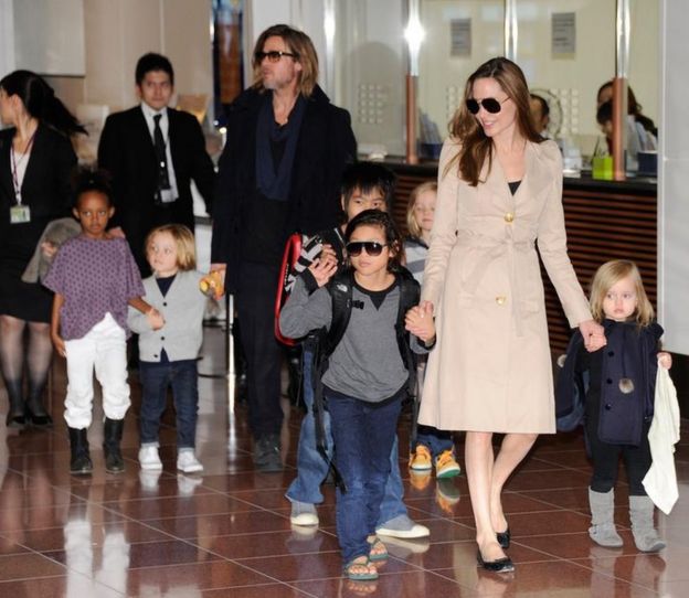 Pictured with their children, US movie stars Brad Pitt and Angellina Jolie arrive at Haneda Airport in Tokyo on November 8, 2011.