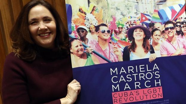 Mariela Castro holds a poster of a documentary that reflects her activism for LGBT rights.