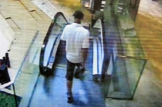 Russian hitman approaching escalator