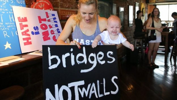 A protester spells out her message in Bangkok, Thailand