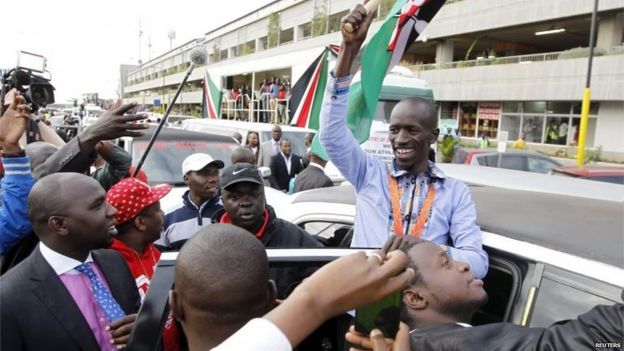 IAAF men's 3000 metres steeplechase gold medallist Kemboi greets his supporters at the Jomo Kenyatta airport Nairobi, Kenya