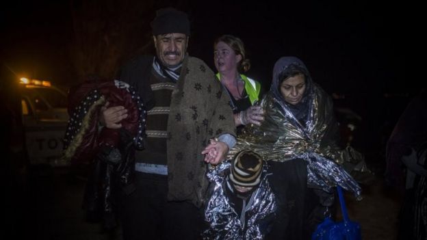 A migrant family arrives on the Greek island of Lesbos after crossing the sea from Turkey. Photo: 23 November 2015